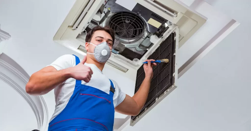 man fixing air conditioner