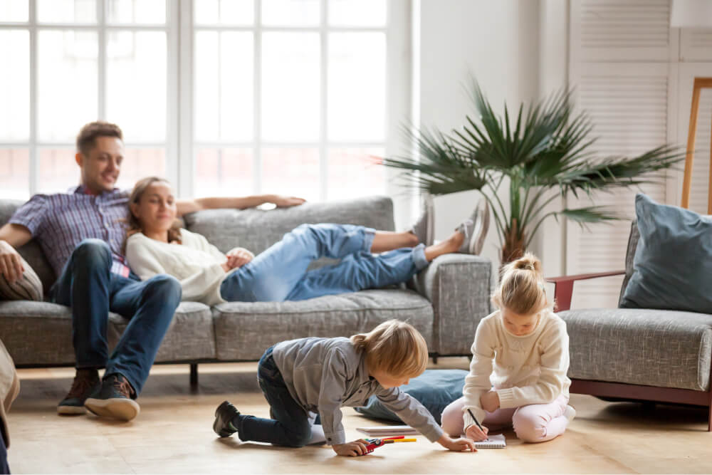 family relaxing with kids in a heated home