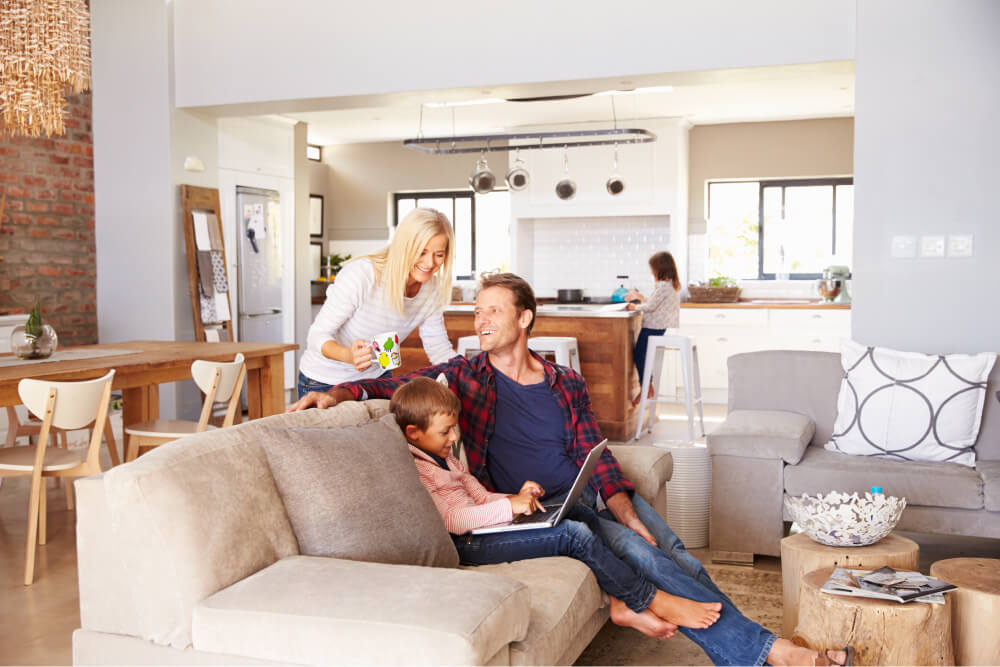 family enjoying air conditioner in home