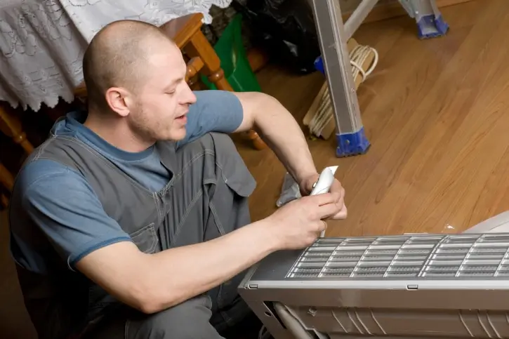 RitePrice professional servicing a ducted heating unit