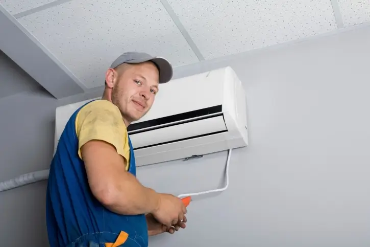 Rite Price Technician installing Evaporative Air Condition Unit